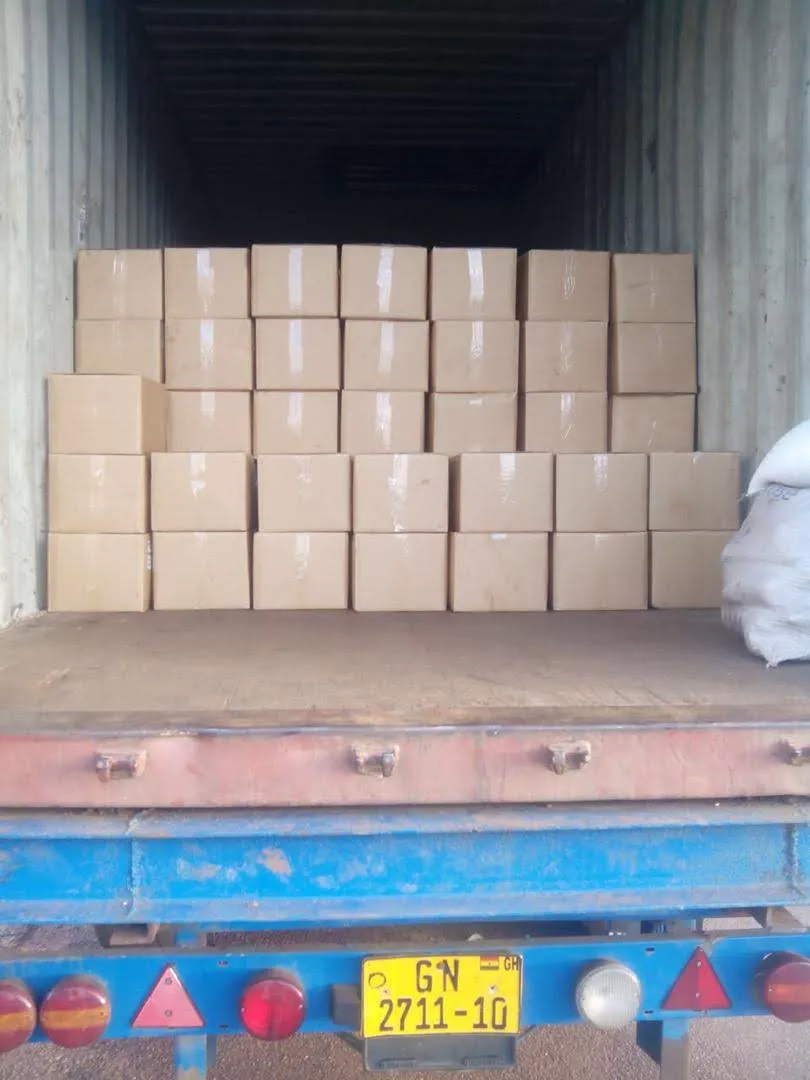 Export cartons stacked inside a container on a truck bed, ready to roll for the terminal