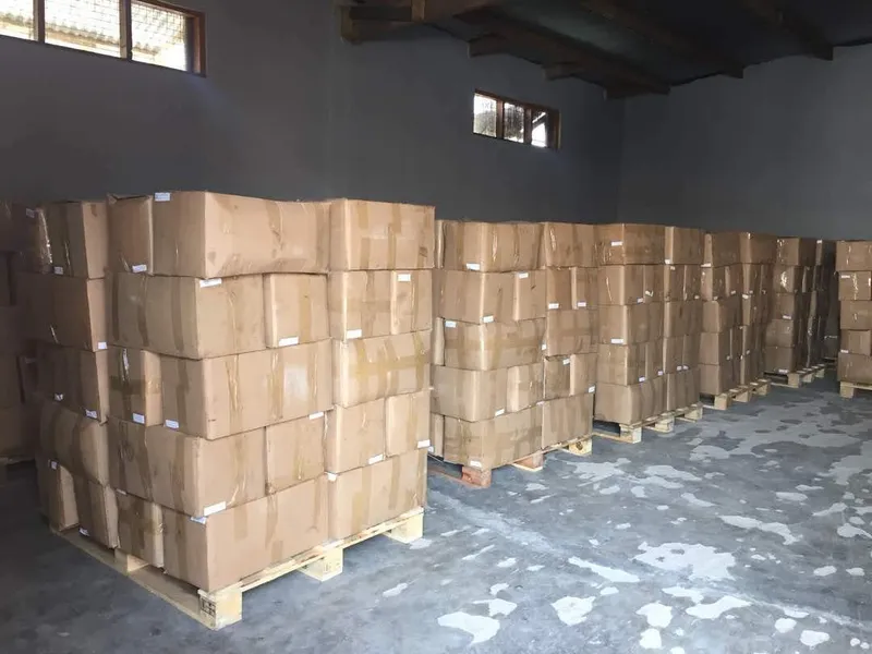Warehouse filled with stacked export cartons on pallets
